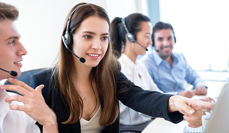 Businesswoman telemarketing staff working with coworker in call Empowered Customer Support Teams
