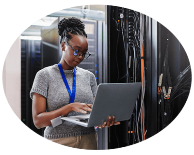 Zultys Deployment Options Woman in server room managing Zultys on-premise and hybrid VoIP deployment options